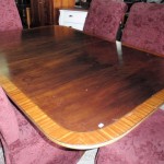 mahogany dining table, 70" long, 46" wide, 29" high, 2 leaves each 13" wide  -  $650.   IGCON